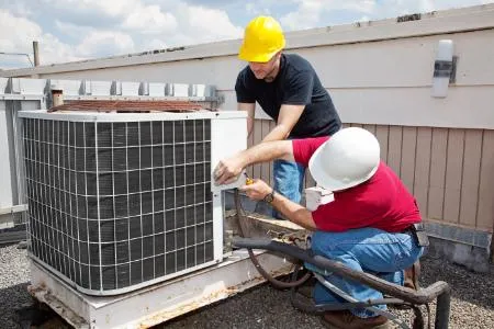 AC repair specialist checking refrigerant levels